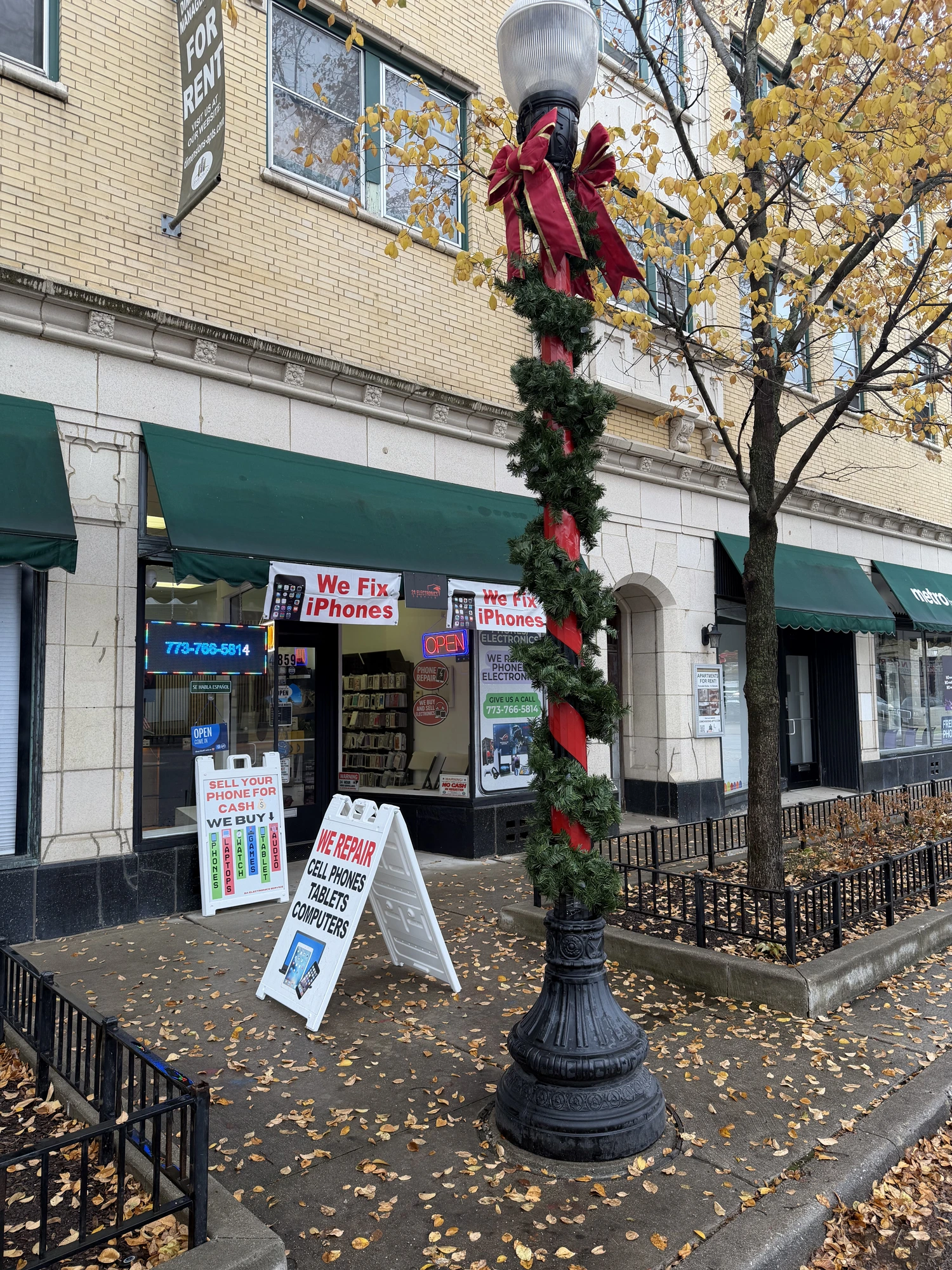 2A Electronics 'We Buy Phones, Laptops, Watches, Games, Tablets, Audio' sign in Chicago