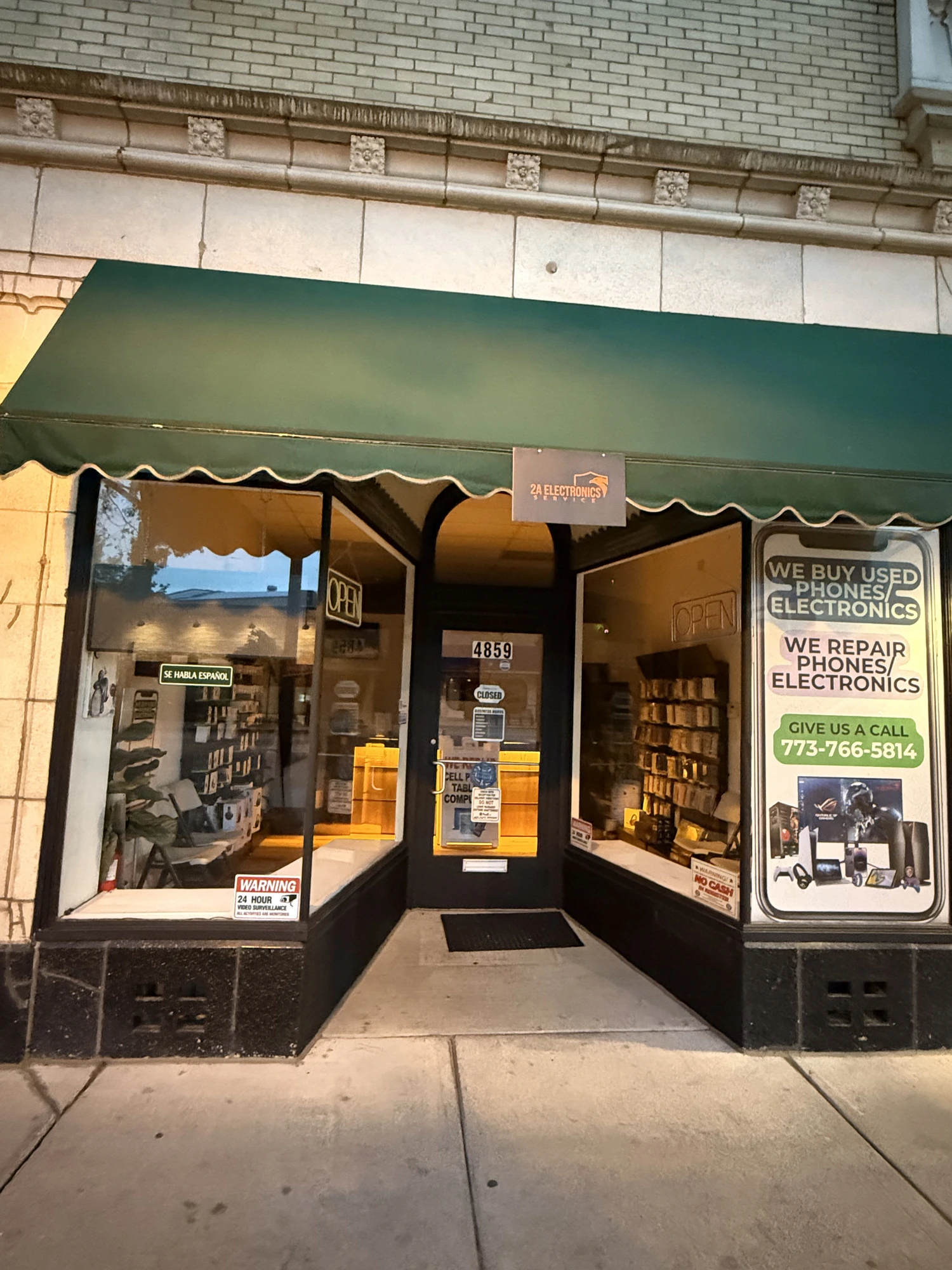 2A Electronics Service storefront in the evening in Irving Park, Chicago