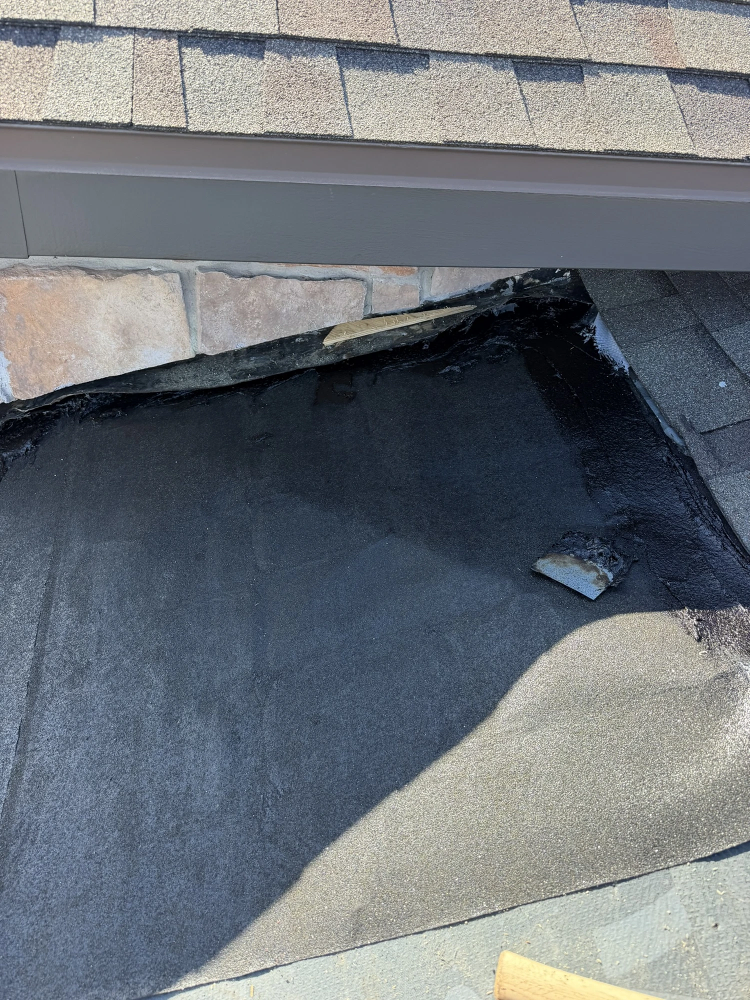 peel-and-stick underlayment installed at a chimney on a Riverview shingle roof