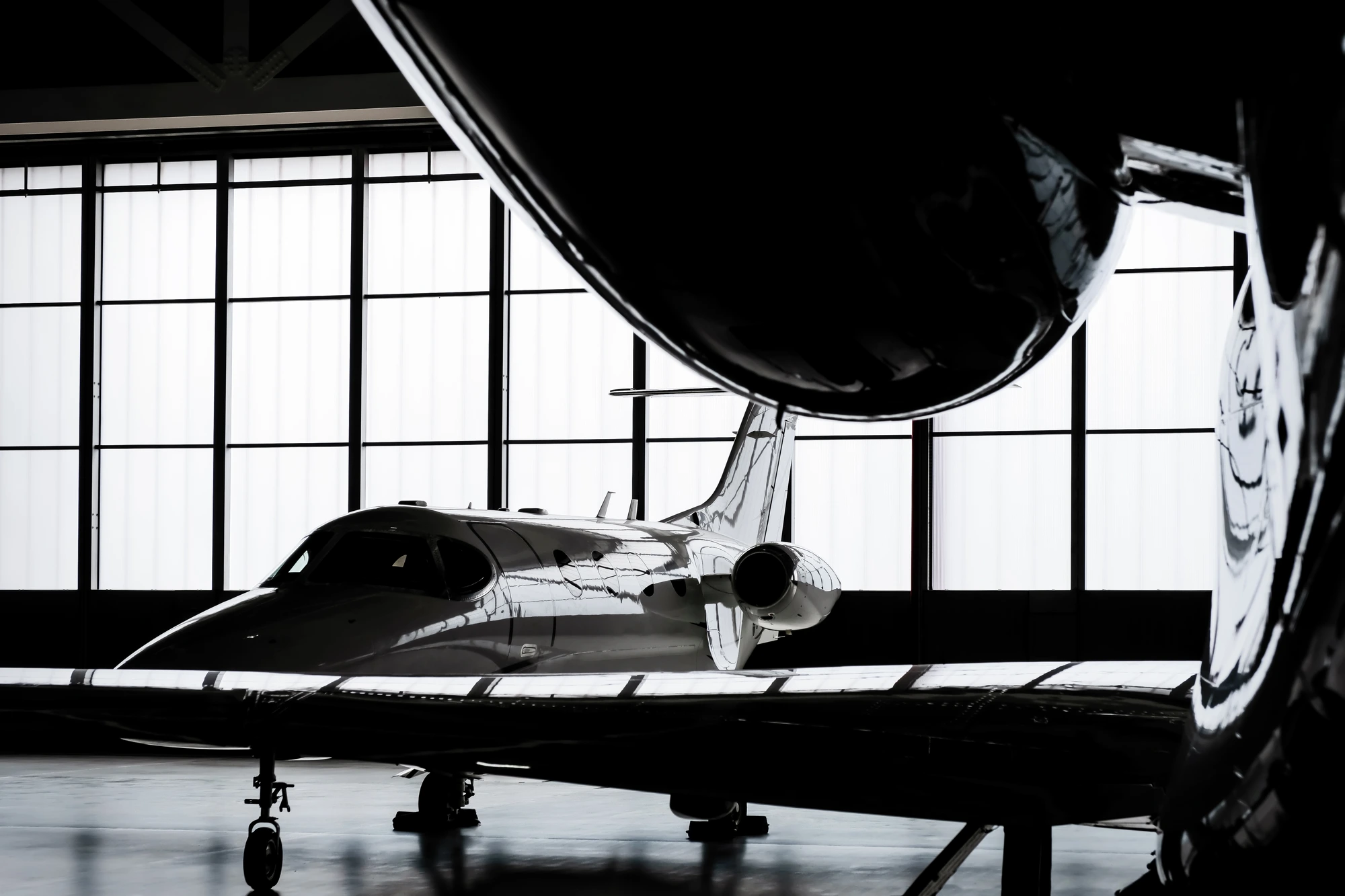 Private jet in a hangar — cinematic silhouette