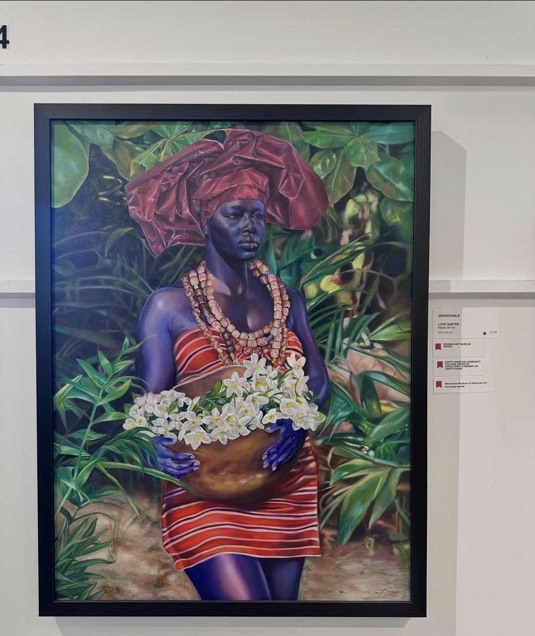 Framed portrait painting with exhibition labels at the Minnesota State Fair