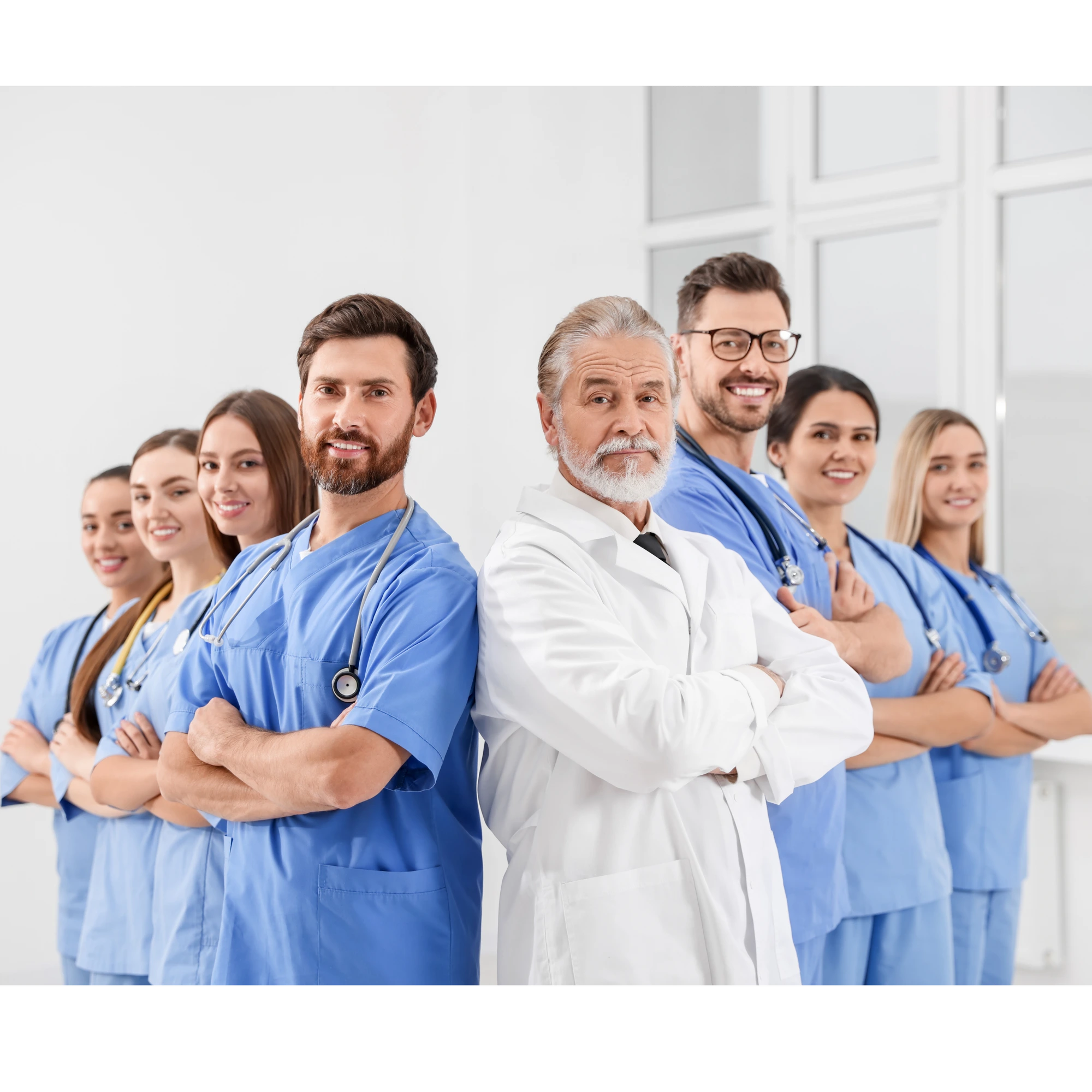 Dr.Asia medical team — nurses, technicians and senior doctor standing confidently in a bright modern hospital