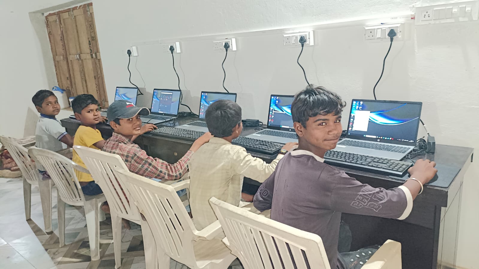 Digital literacy lab — boys learning computer basics