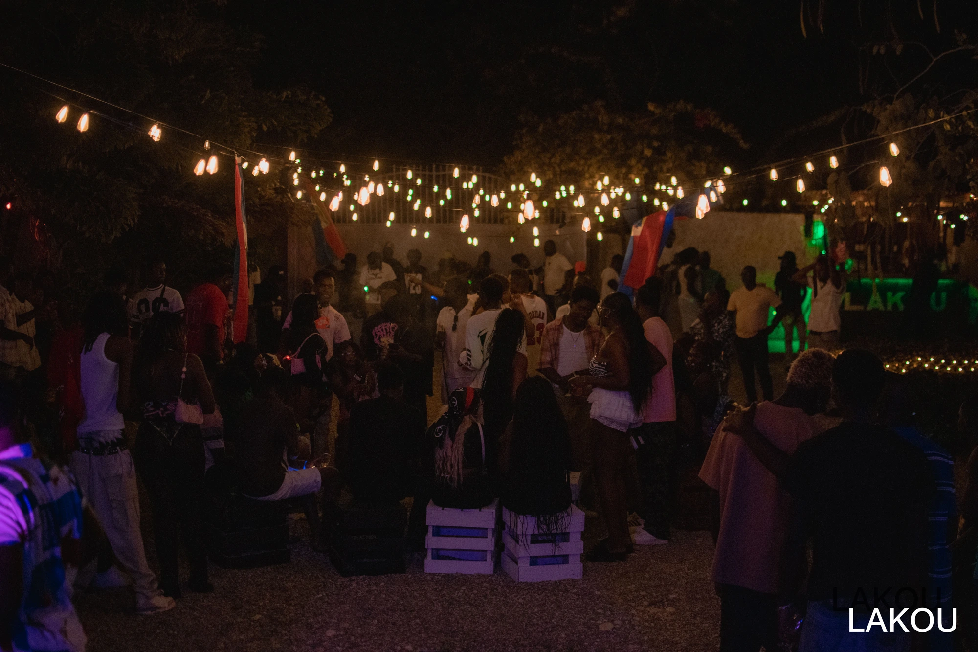 The LAKOU booth — flags up by day