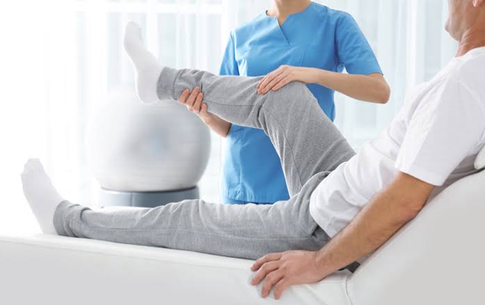 Physiotherapist treating a patient